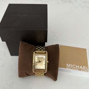 Michael Kors gold tone watch with original box.
